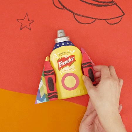 DIY Rocket Ship made with French's mustard container and model magic crayons. 