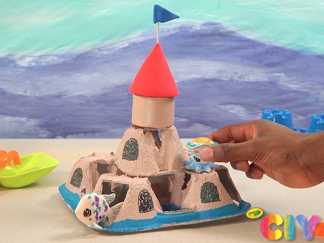 Adding Scribble Scrubbie toys and enjoying the new sandcastle
