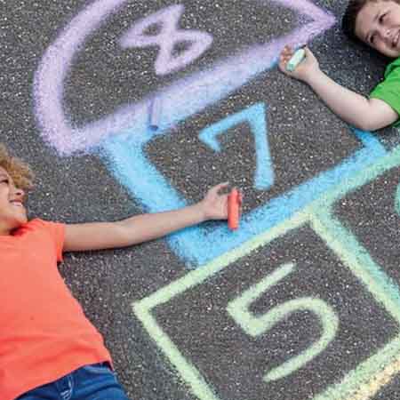 Children playing hopscotch. 