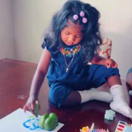 Child using vegetables as stamps.