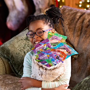 Crayola Scribble Scrubbie Pets in stockings above fireplace