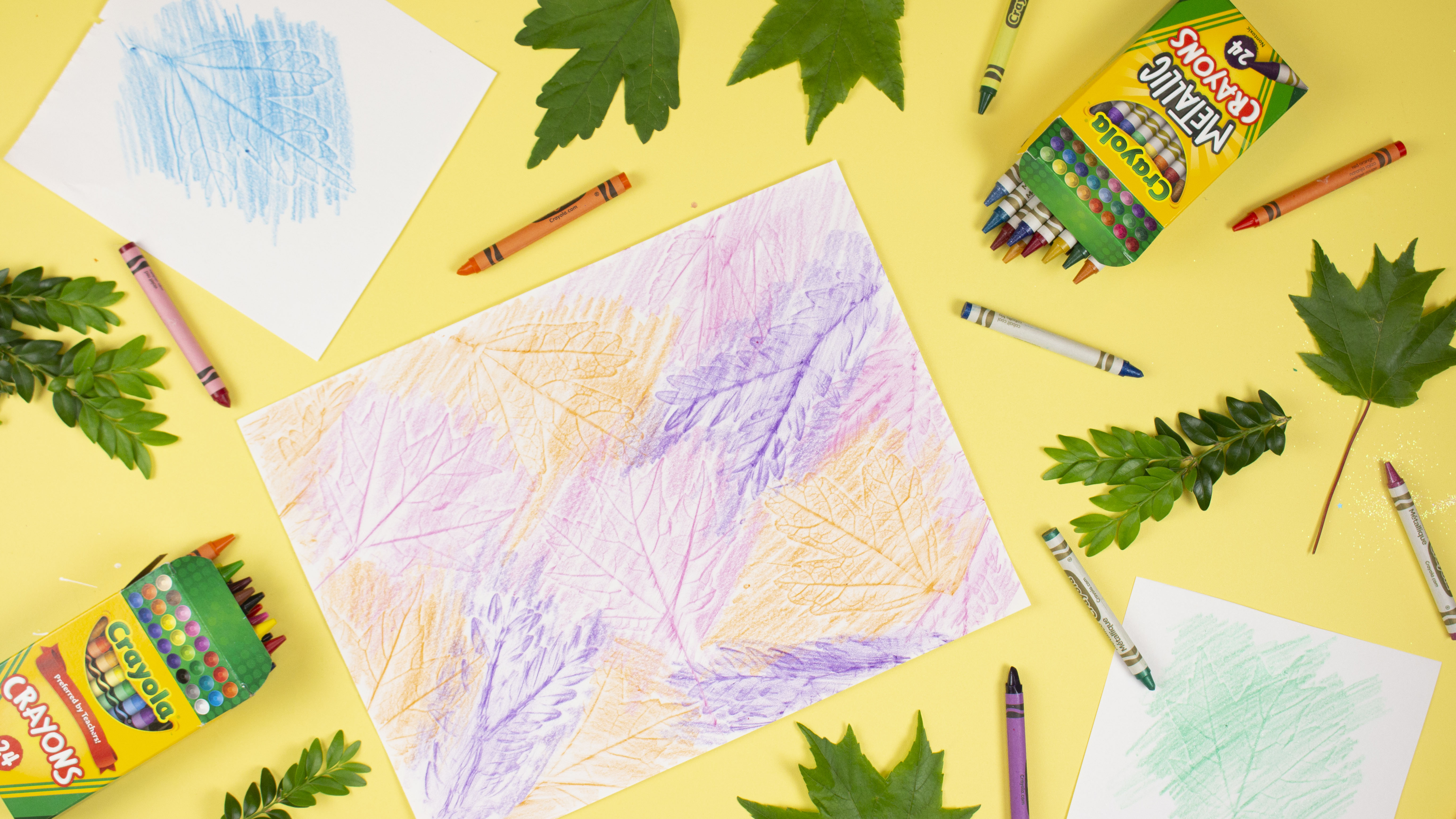 Crayons with leaves and traced on paper