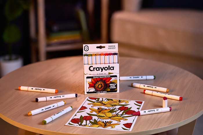 Crayola Color Collections Dual-Tip Alcohol-Based Markers, Garden Harvest - 8ct. Packaging and contents on table with colored image.