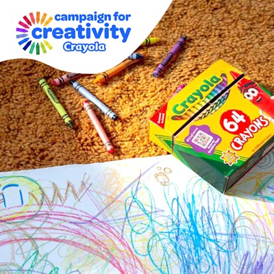 Crayons and a child's drawing.