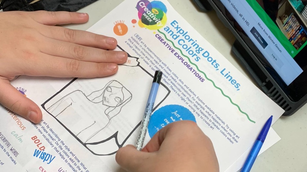Child completing thinking sheet