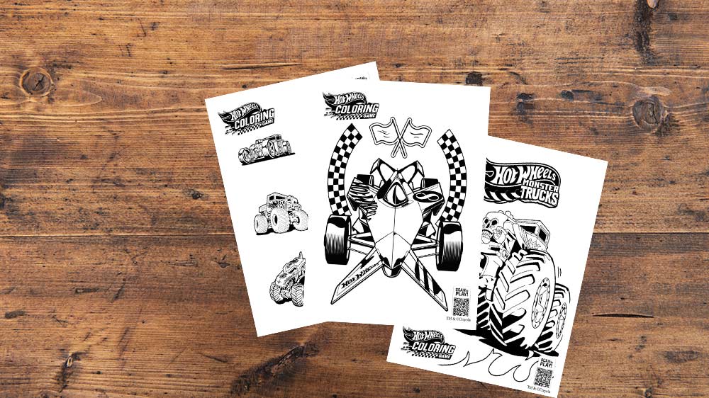 three hot wheels coloring pages on wood table.