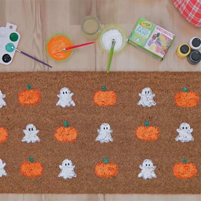 DIY Halloween welcome mat with pumpkins and ghosts