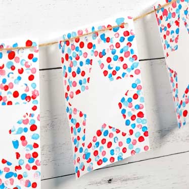 white rectangular paper with red star, and red and blue dots being applied with a cotton swab.