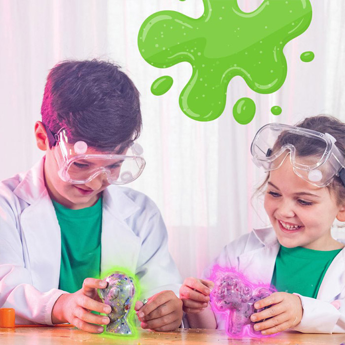 Young girl pulling Crayola Goo and stretching it