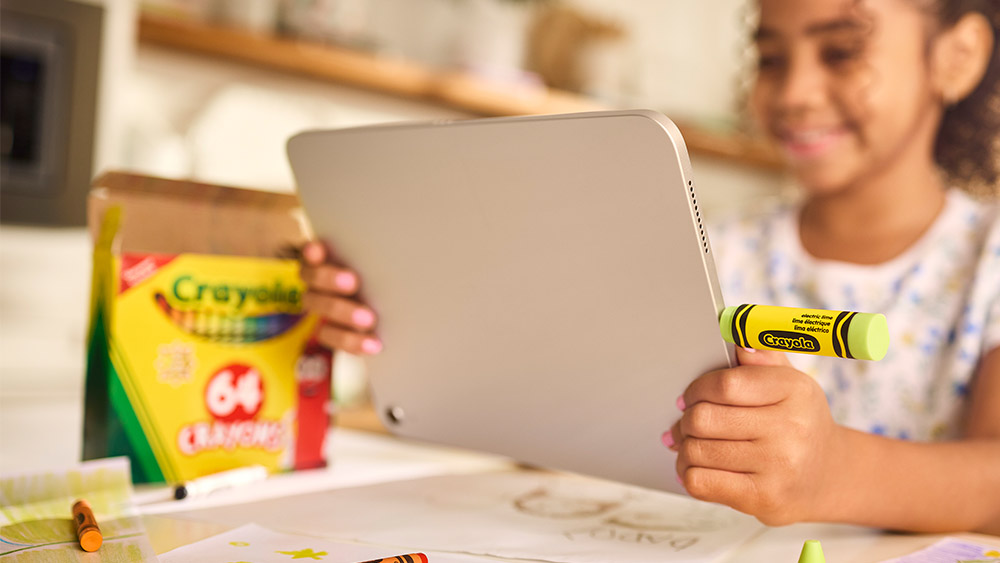 Child using a Sandisk crayon USB to save art
