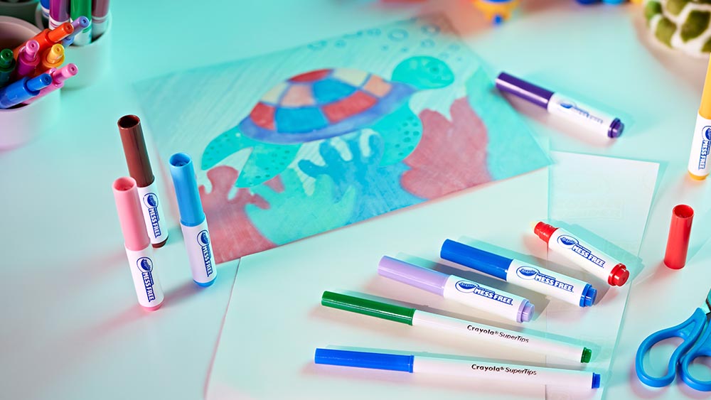 Color wonder markers on a desk.