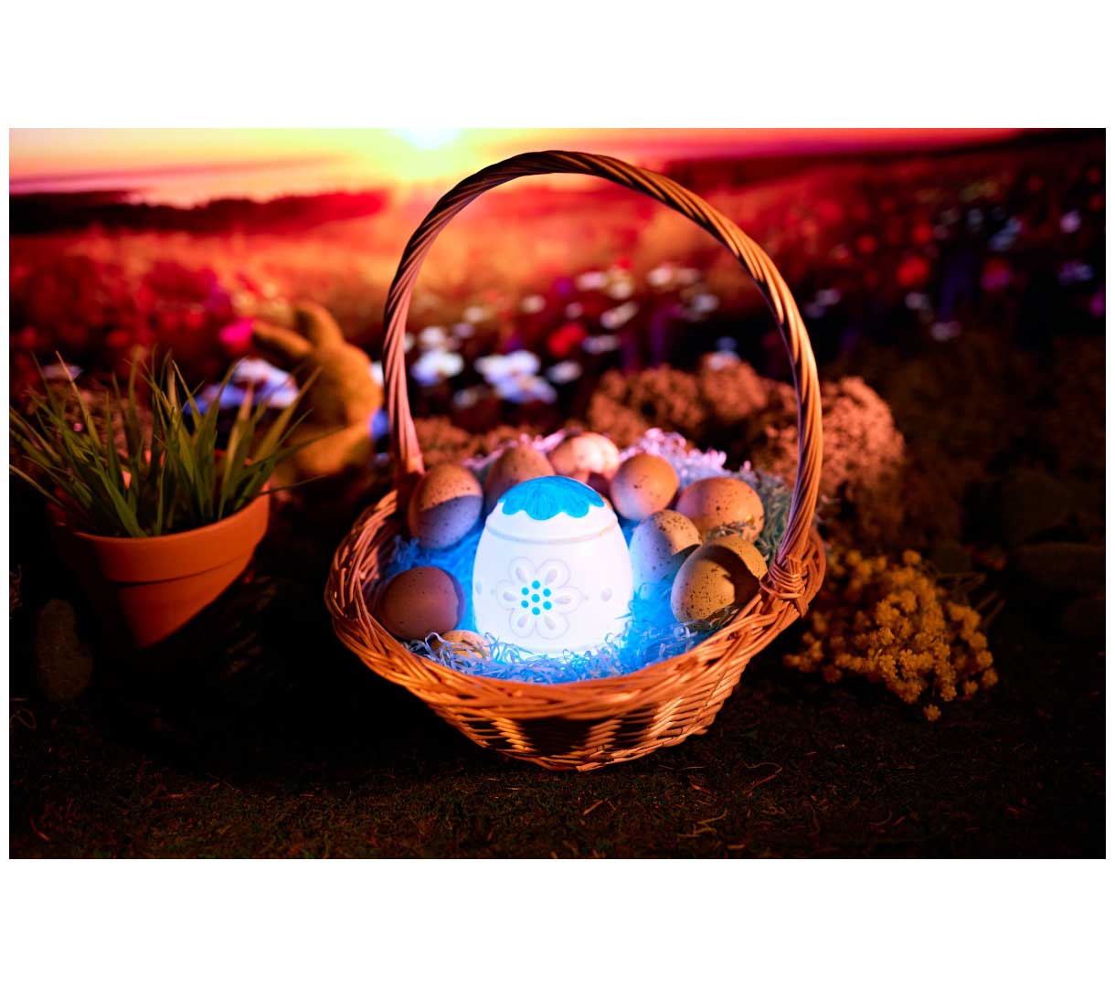 Lights-Up Egg decorated and glowing blue in easter basket