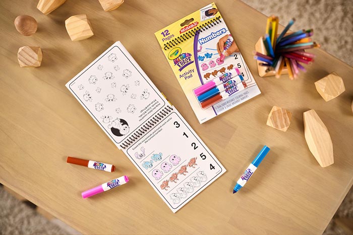 Color & Erase Reusable Activity Pad, Numbers packaging and contents on table.