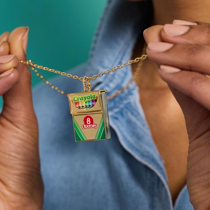 Crayola Teacher Appreciation Crayon Box Locket. Woman holding up crayon box locket.