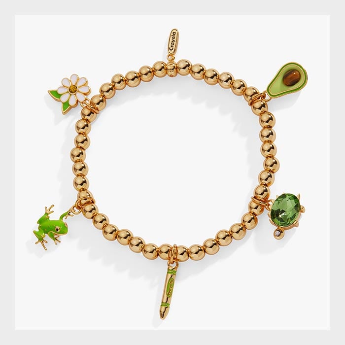 Crayola Charm Stretch Bracelet. gold bracelet with forest green charms.