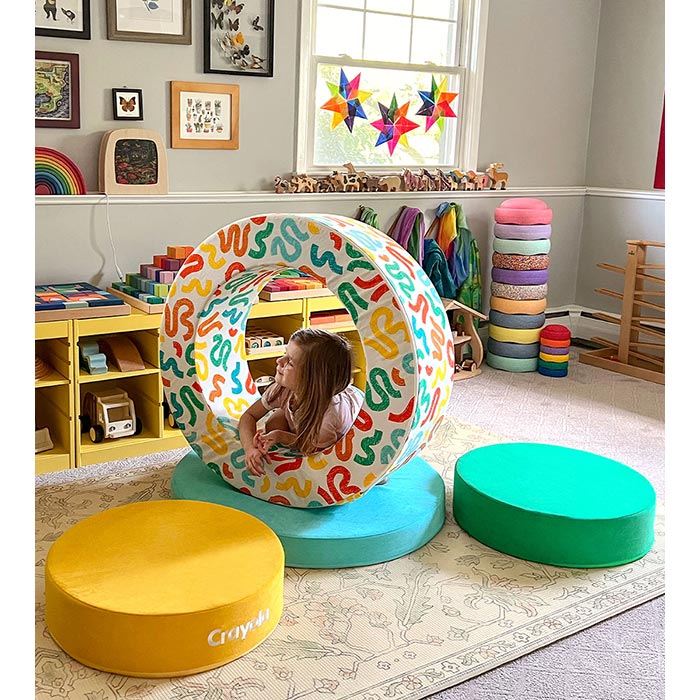 The Crayola Chunk® components with child sitting inside hoop.