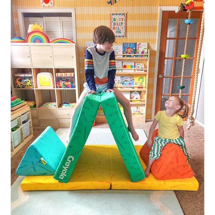 The Crayola Nugget®. boy and girl sitting on Crayola Nugget pieces.
