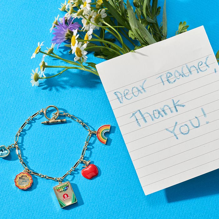 Crayola Teacher Appreciation Toggle Bracelet. Toggle bracelet next to thank you note and flowers.