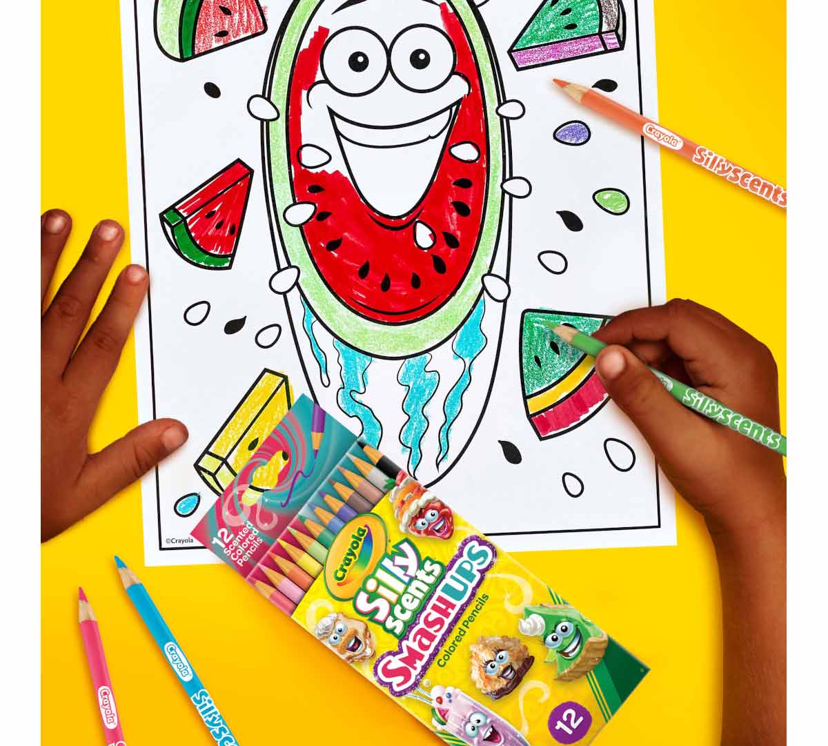 Silly Scents SmashUps Colored Pencils  12 Count.  Watermelon coloring page being colored in with Silly Scents SmashUps colored pencils.