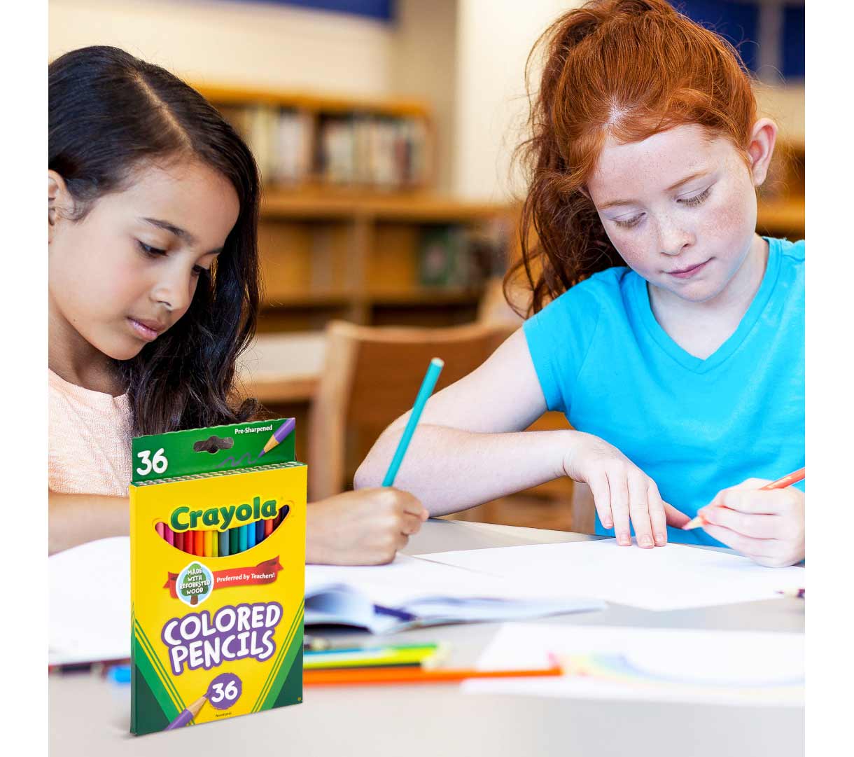 Two long haired children using Crayola colored pencils  36 count.