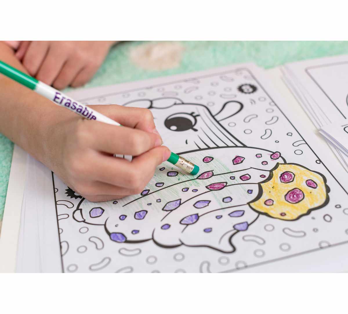 Erasable colored pencils  10 count. Hand erasing colored pencil marks from coloring page.