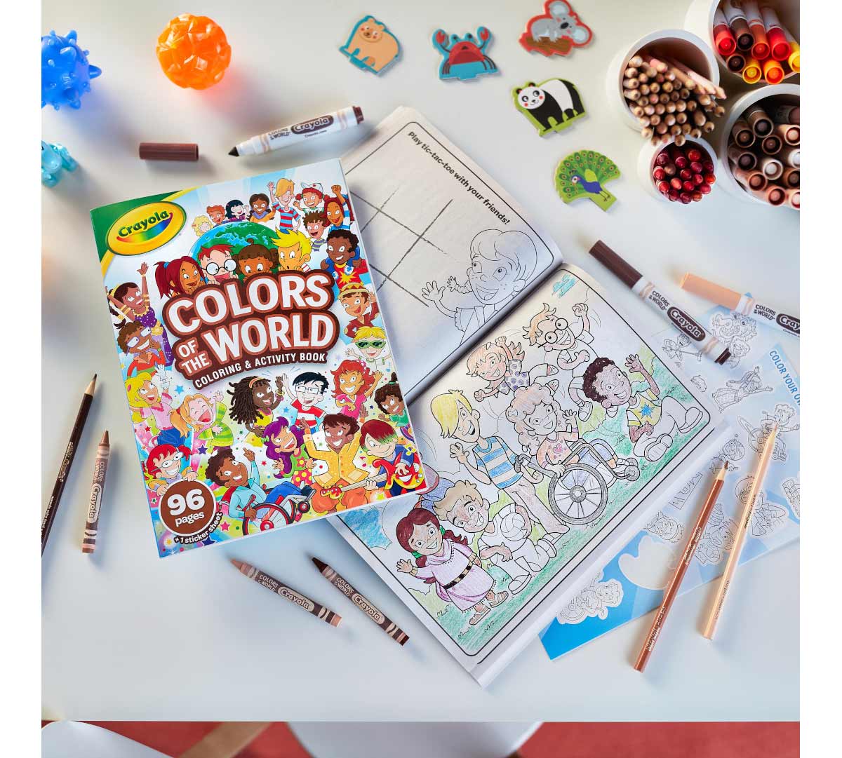 Colors of the World 96 page coloring book on top of partially colored open page depicting a variety of children