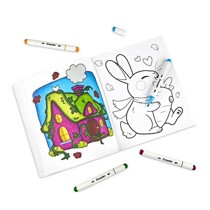 Cozy Cottages Adult Coloring Book, 32 Pages. Book open to select page with alcohol markers scattered around.