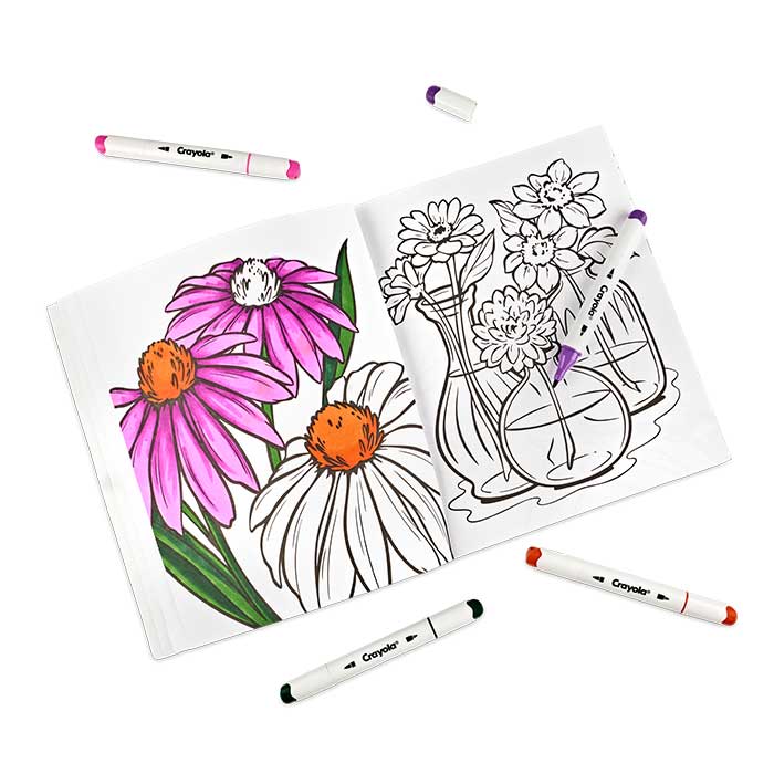 Flower Child Adult Coloring Book, 32 Pages. Open book surrounded by crayola alcohol markers.  selected page partially colored.