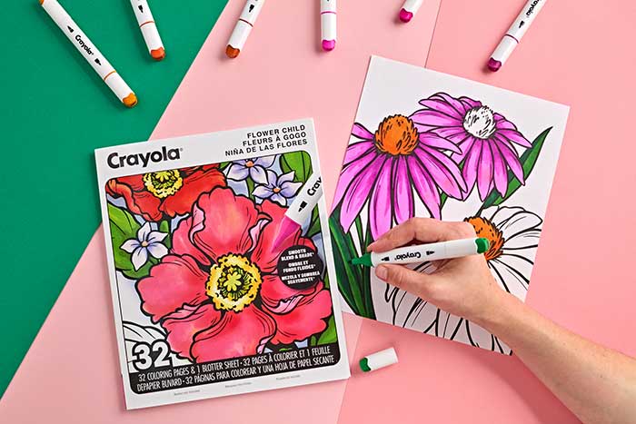 Flower Child Adult Coloring Book, 32 Pages. book and select page surrounded by crayola alcohol markers.