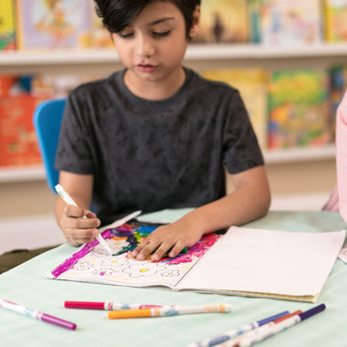 Ultra-Clean Washable Markers, Fine Line, Classic Colors, 8 count. child using markers in a coloring book.