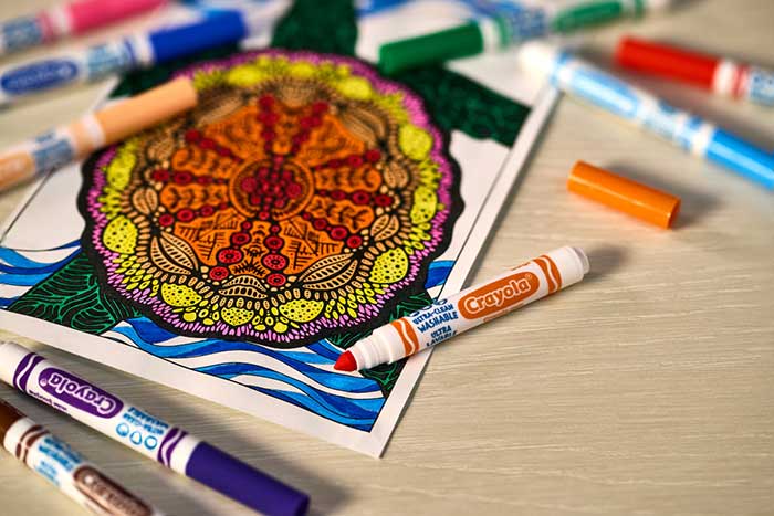 Ultra-Clean Washable Broad Line Markers on table with coloring page completed using the markers.