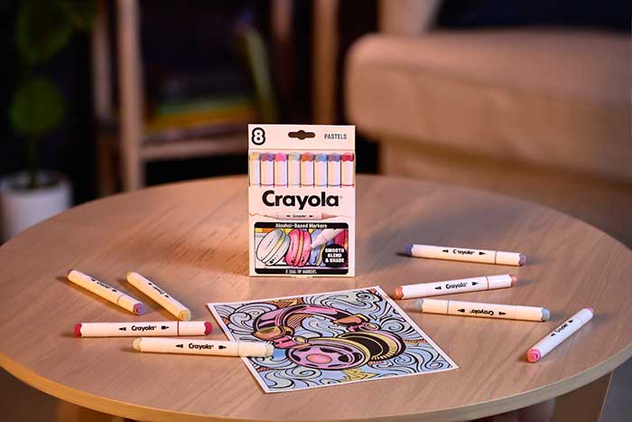 Crayola Color Collections Dual-Tip Alcohol-Based Markers, Pastels - 8ct. Packaging and contents on table with a colored image.