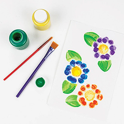 water bottle flowers craft shot including paintbrushes and paint
