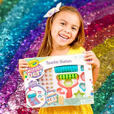 Kid holding Glitter Dots Sparkle Station Craft Kit